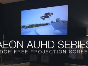 Elite Screens Aeon AcousticPro UHD Series edge-free projection screen with sound system.