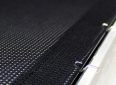 Elite Screens outdoor projector screen with durable black backing and sturdy mounting hardware.