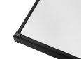 Portable projector screen with sleek black frame and white surface for home or business use.