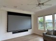 Elite Screens projector screen for home theater setup.