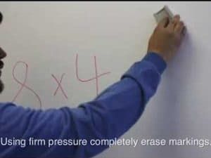 Man erases markings on an Ambient Light Rejecting WhiteBoardScreen™ for clear projection.