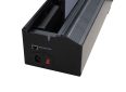 Motorized projector screen roller with control port and power switch.