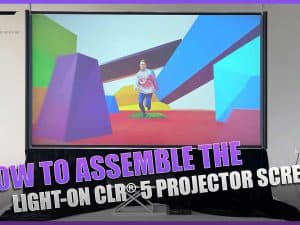 Large projector screen with colorful geometric background for presentations and entertainment.