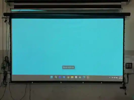 Elite Screens projector screen displaying a blue background for home theater setup.