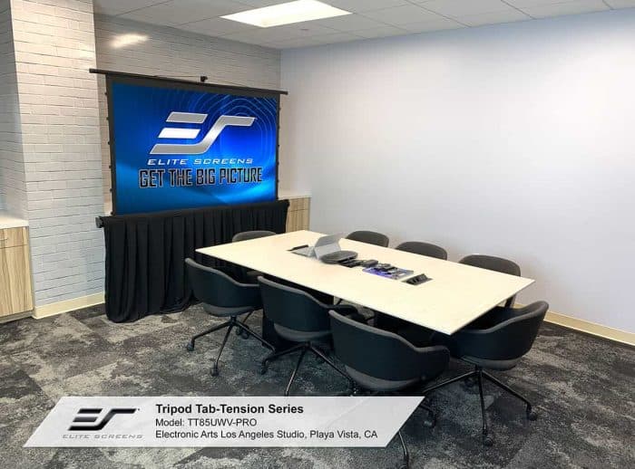 Elite Screens Projector Screens Tension Series projector screen in a conference room.