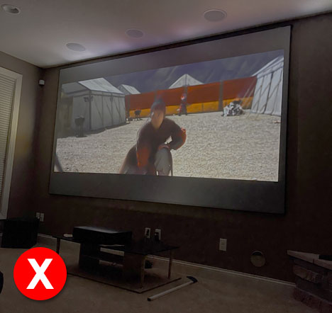 Image shows how a UST projector with CineGrey 3D® looks like in a room with lights turned off