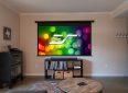 Elite Screens projector screen with colorful bokeh background for home theater.