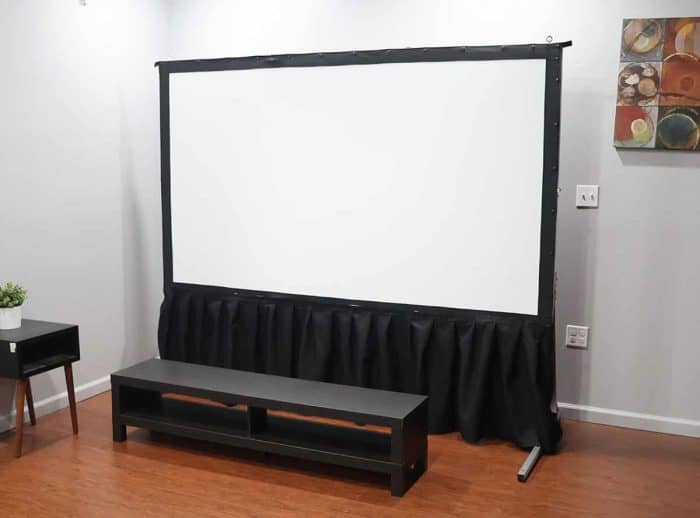 Elite Screens Projector Screen Setup Elite Screens projector screen with black frame and stand in a modern room.